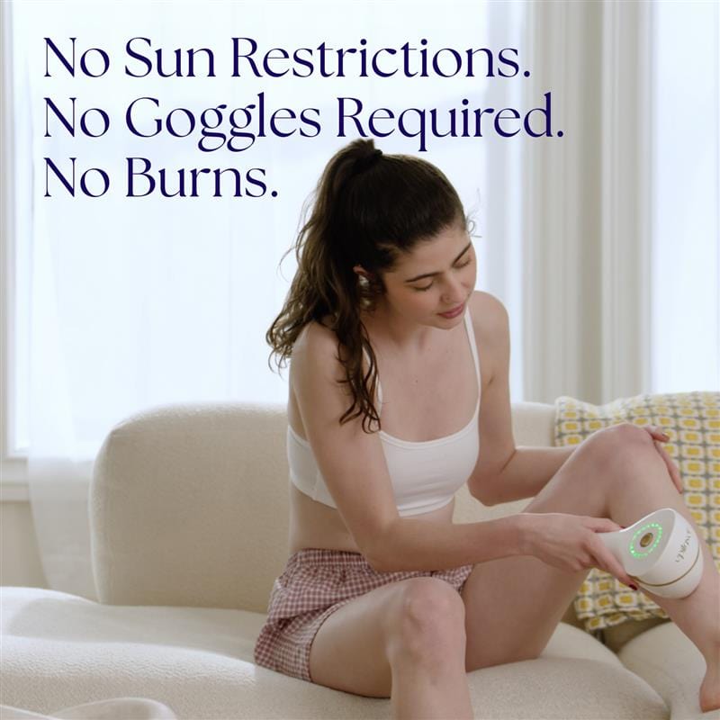 Woman using Epilaser laser hair removal device on leg