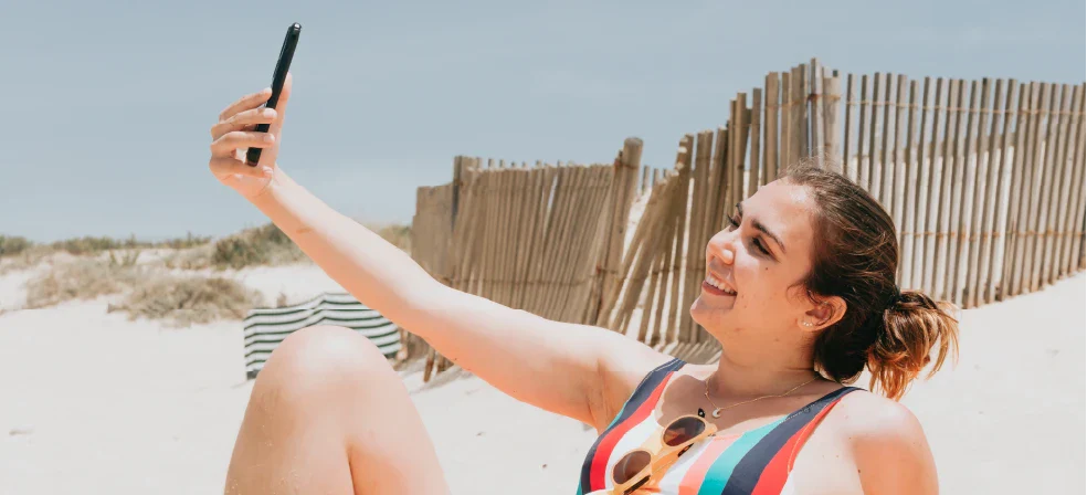 Woman with Smooth Skin Taking Selfie on Beach