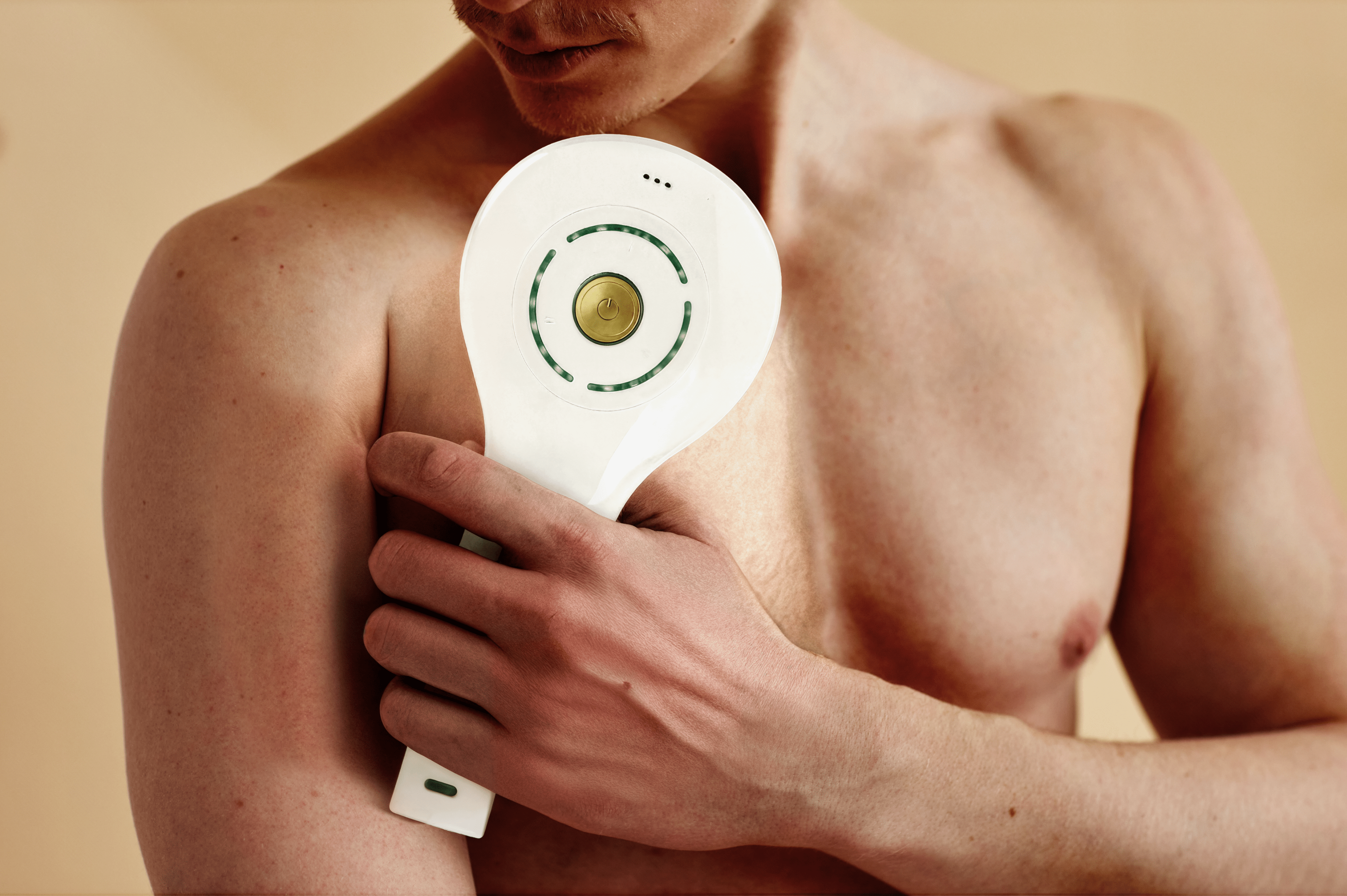 Man using Epilaser laser hair removal device  on chest for smooth skin